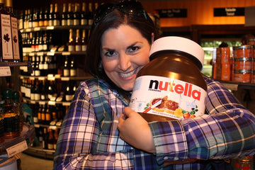 Laura hugging big Nutella jar