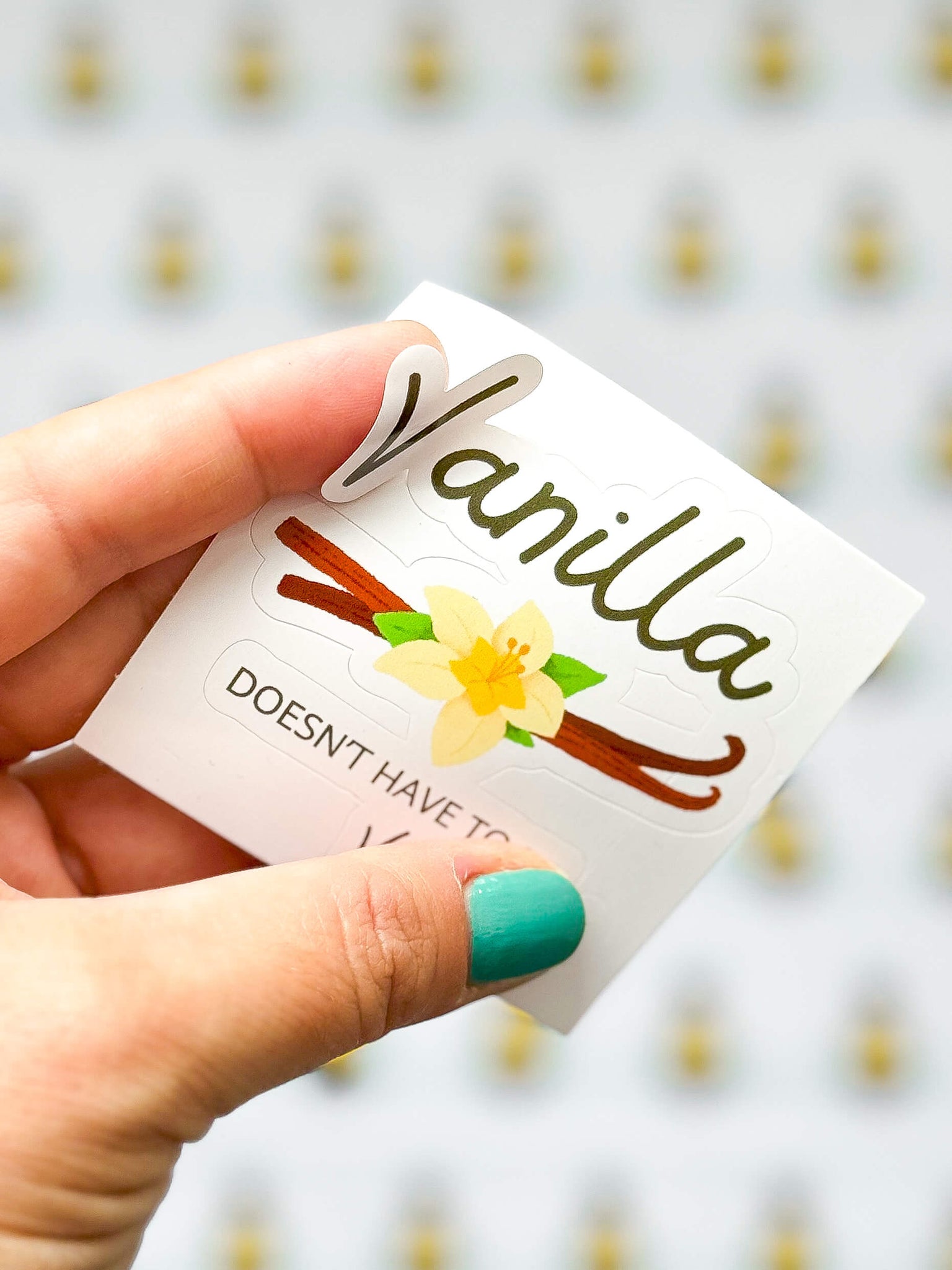 Vanilla bubble-free sticker being held.