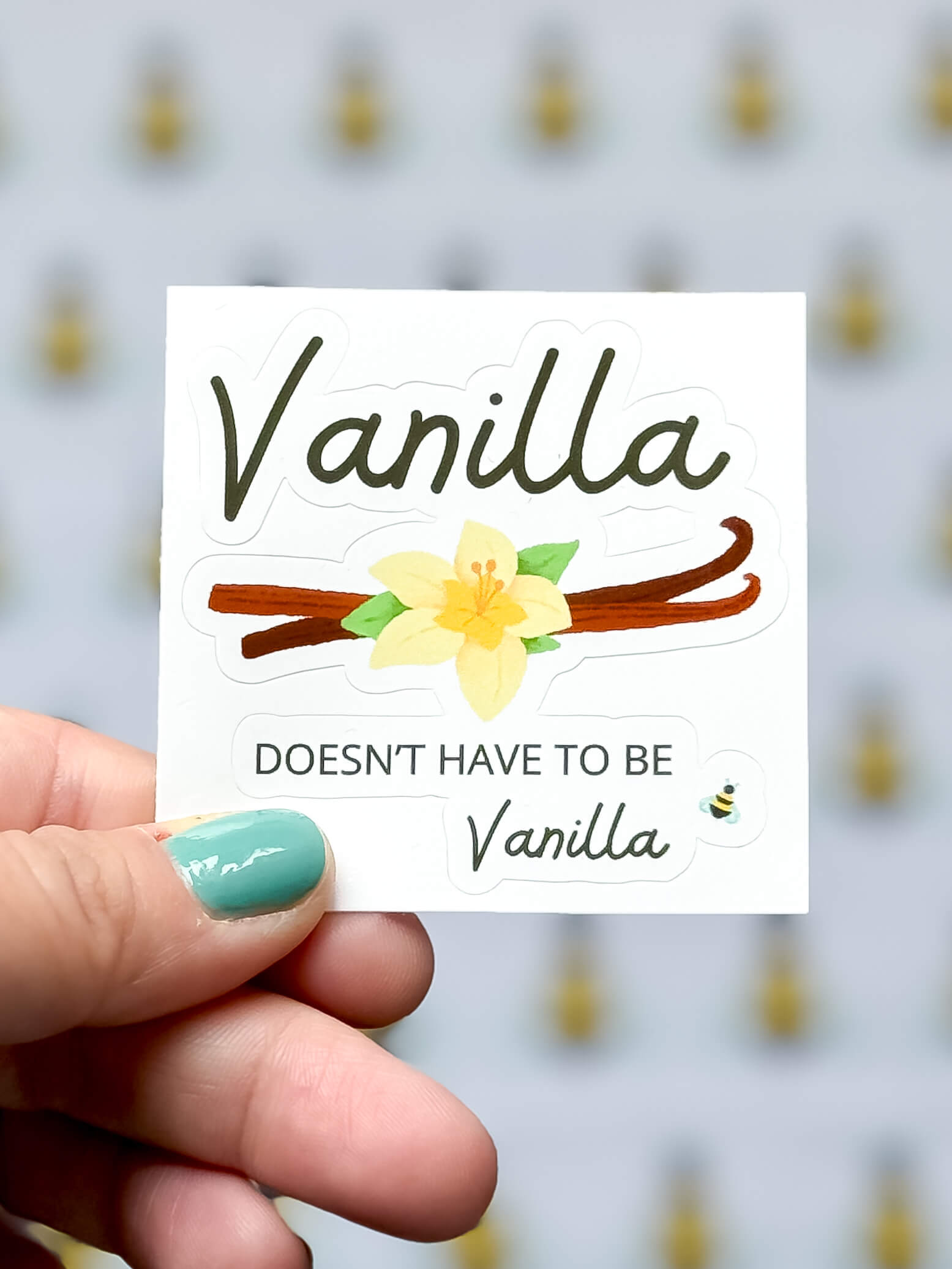 Vanilla bubble-free sticker being held.